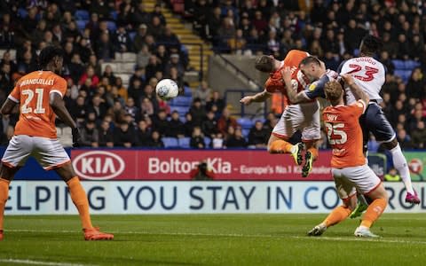 Bolton Wanderers' Daryl Murphy (3rd right) heads at goal during the Sky Bet League One match between Bolton Wanderers and Blackpool  - Credit: Getty images