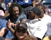 Colin Kaeperick, left, talks with Kobe Bryant while watching the second round of the US Open tennis championships Thursday, Aug. 29, 2019, in New York. (AP Photo/Eduardo Munoz Alvarez)