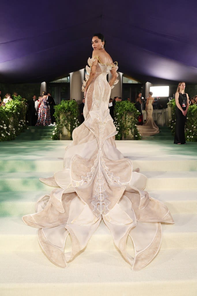 The scalloped train of her gown artfully cascaded down the Met Museum steps. Getty Images for The Met Museum/Vogue