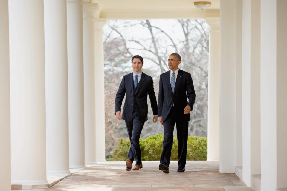 President Barack Obama and Prime Minister Justin Trudeau walk through the colonnade to speak at a bilateral news conference in the Rose Garden of the White House in Washington, Thursday, March 10, 2016. (AP Photo/Andrew Harnik)