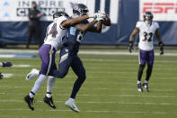 Baltimore Ravens cornerback Marlon Humphrey (44) breaks up a pass intended for Tennessee Titans wide receiver Corey Davis (84) in the second half of an NFL wild-card playoff football game Sunday, Jan. 10, 2021, in Nashville, Tenn. (AP Photo/Mark Zaleski)