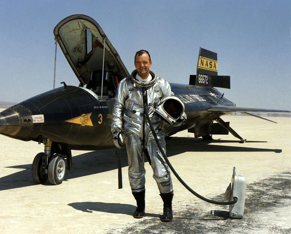 FILE - This 1967 file image provided by NASA shows research pilot Bill Dana in front of the X-15 on the dry lake bed at the Dryden Flight Research Center at Edwards Air Force Base, Calif. Dana, the famed research test pilot who flew the X-15 rocket plane and other pioneering aircraft, died Tuesday, May 6, 2014. He was 83. (AP Photo/NASA, File)