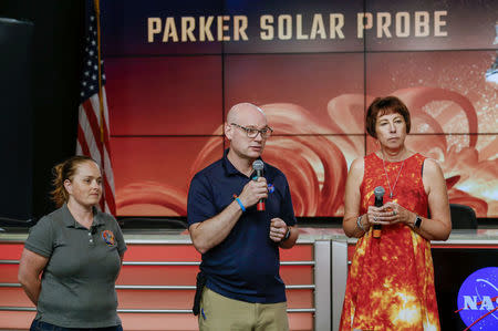 Alex Young, solar scientist at NASA's Goddard Space Flight Center (middle), Nicola Fox, Parker Solar Probe project scientist at Johns Hopkins Applied Physics Laboratory (APL) (right), and Betsy Congdon, Parker Solar Probe Thermal Protection System lead engineer at APL (left), speak during a preview briefing on the NASA's Parker Solar Probe at NASA's Kennedy Space Center in Florida, U.S., July 20, 2018. REUTERS/Mike Brown