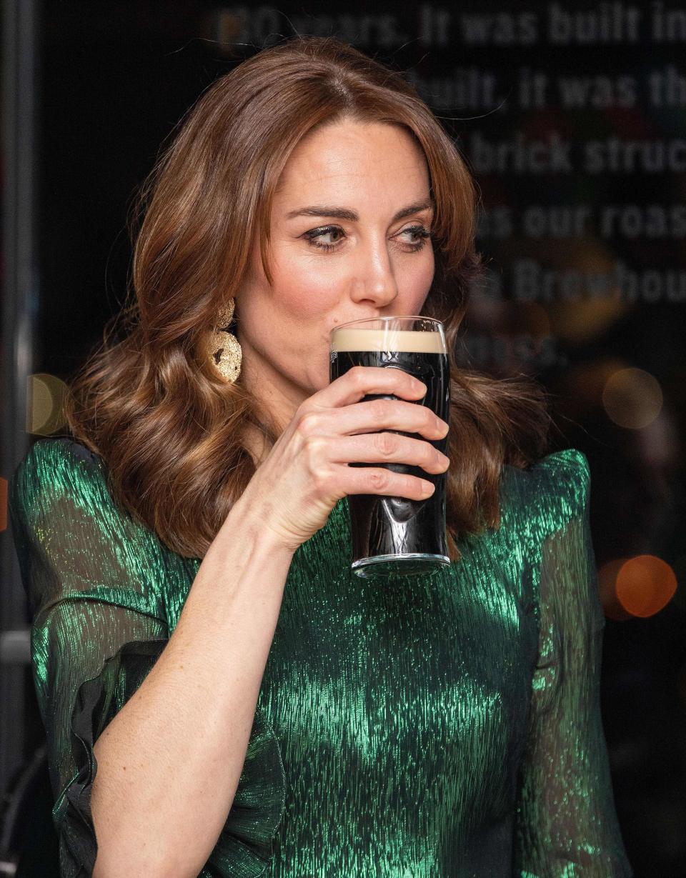 Britain's  Catherine, Duchess of Cambridge, drinks a  pint of Guinness during as she attends a special reception at the Guinness Storehouses Gravity Bar in Dublin on March 3, 2020 on the first day of their Royal Highnesses three-day visit. (Photo by PAUL FAITH / various sources / AFP) (Photo by PAUL FAITH/AFP via Getty Images)