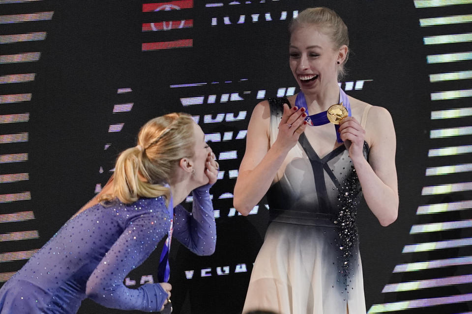 Second-place Amber Glenn, left, and first-place Bradie Tennell smile after receiving their medals at the U.S. Figure Skating Championships, Friday, Jan. 15, 2021, in Las Vegas. (AP Photo/John Locher)