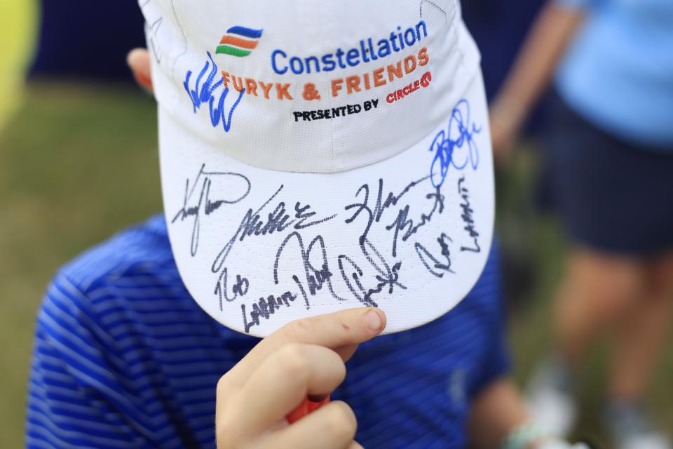 A young fan shows off all the signatures he acquired during the second round of the Constellation Furyk & Friends PGA Tour Champions golf tournament Saturday, Oct. 7, 2023 at Timuquana Country Club in Jacksonville, Fla. [Corey Perrine/Florida Times-Union]