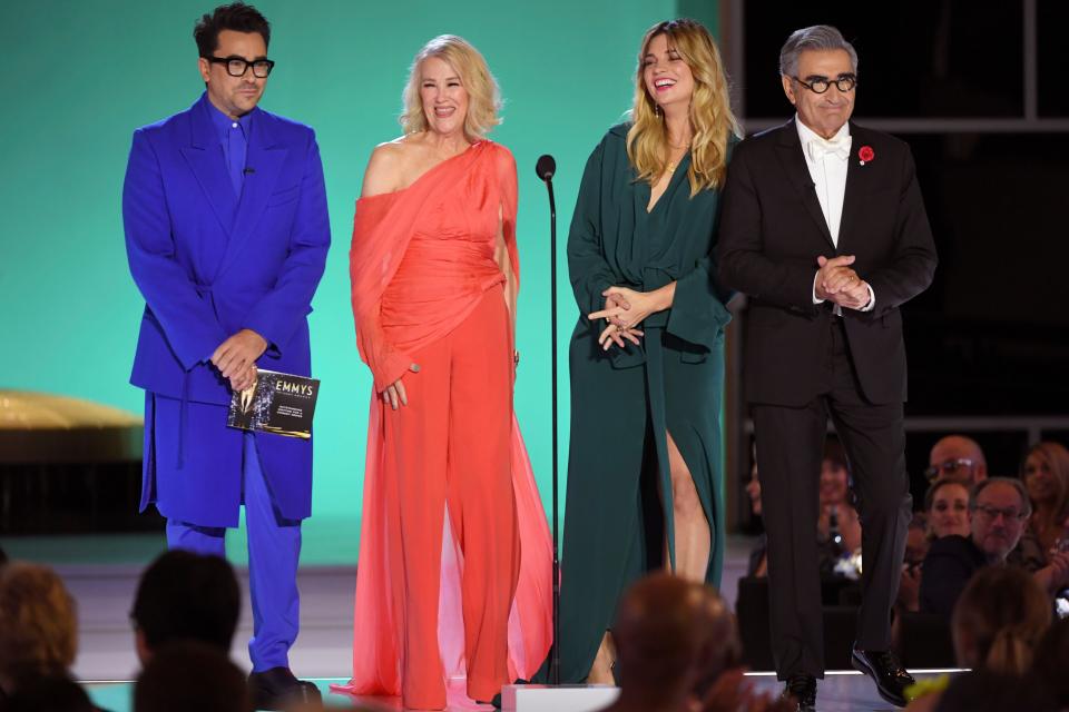 Dan Levy, from left, Catherine O'Hara, Annie Murphy, and Eugene Levy present the award for outstanding writing for a comedy series.