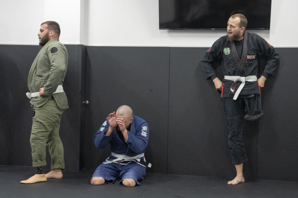 War veterans attend a jiu jitsu training session in Kyiv, Ukraine, Tuesday, Oct. 3, 2023. More than 20,000 people in the Ukraine have lost limbs from injuries since the start of the Russian war, many of them soldiers. Some of them have learned to deal with their psychological trauma by practicing a form of Brazilian jiu-jitsu. (AP Photo/Efrem Lukatsky)