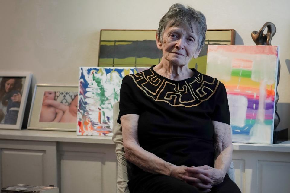 Ellen Ensig-Brodsky, 89, a LGBTQ rights activist, pose in her home, Wednesday, June 22, 2022, in New York. Even with ailing knees, Ensig-Brodsky said she plans to be on the Pride Parade route on Sunday. "The parade is the display, publicly, of my identity." (AP Photo/Bebeto Matthews)