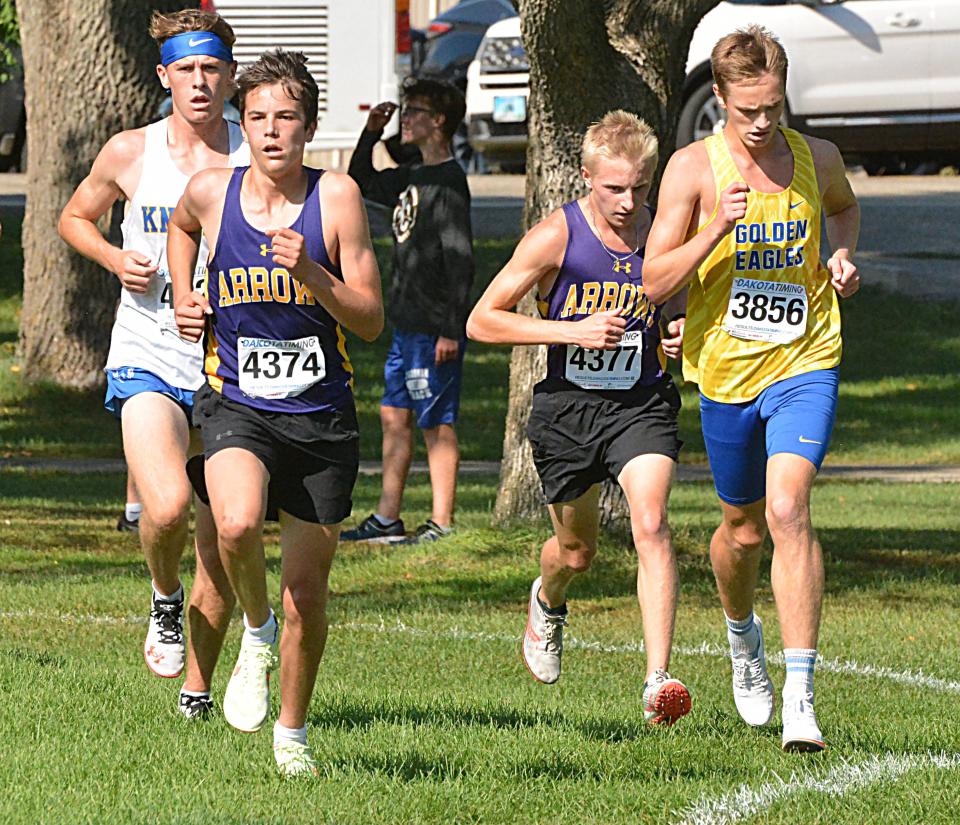 Watertown's Dane Stark (left) and Ty Sullivan battle Aberdeen Central's David VanVeen and an O'Gorman runner for position in the varsity boys' 5,000-meter run during the Watoma Invitational cross country meet on Thursday, Sept. 28, 2023 at Cattail Crossing Golf Course in Watertown.