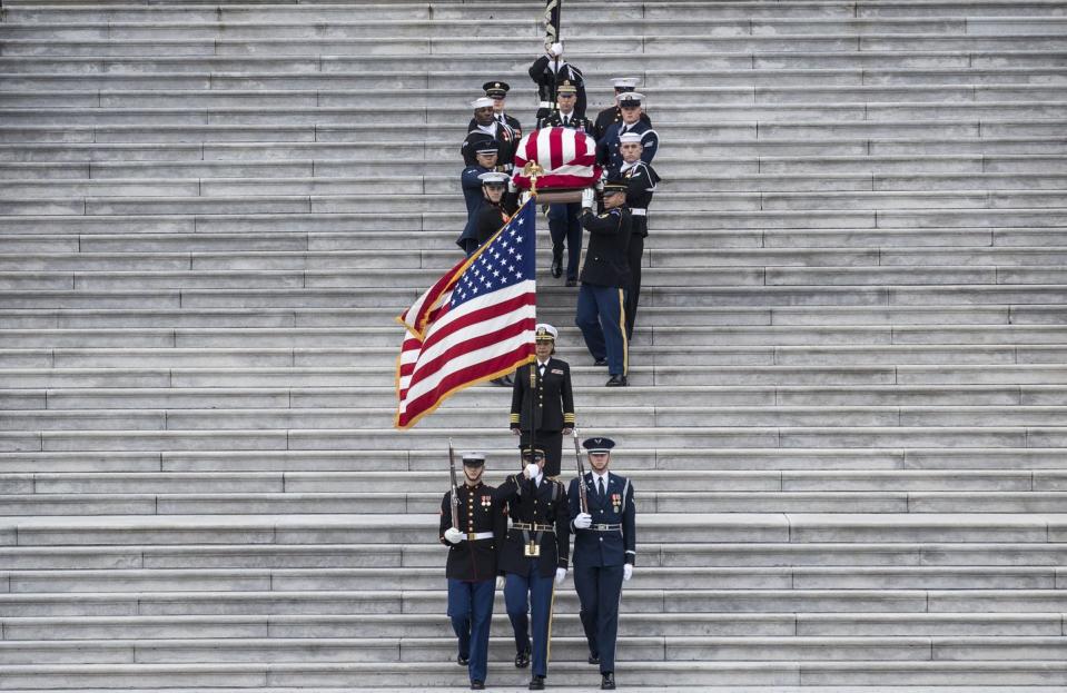 <p>A joint services military honor guard carries Bush's casket at the U.S. Capitol.</p>