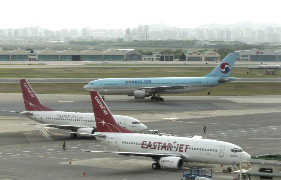 South Korea' passenger planes are seen at Gimpo Airport in Seoul, South Korea, Wednesday, May 2, 2012. A South Korean official said jamming signals from North Korea are affecting dozens of civilian airplanes flying in and out of South Korea. (AP Photo/Ahn Young-joon)