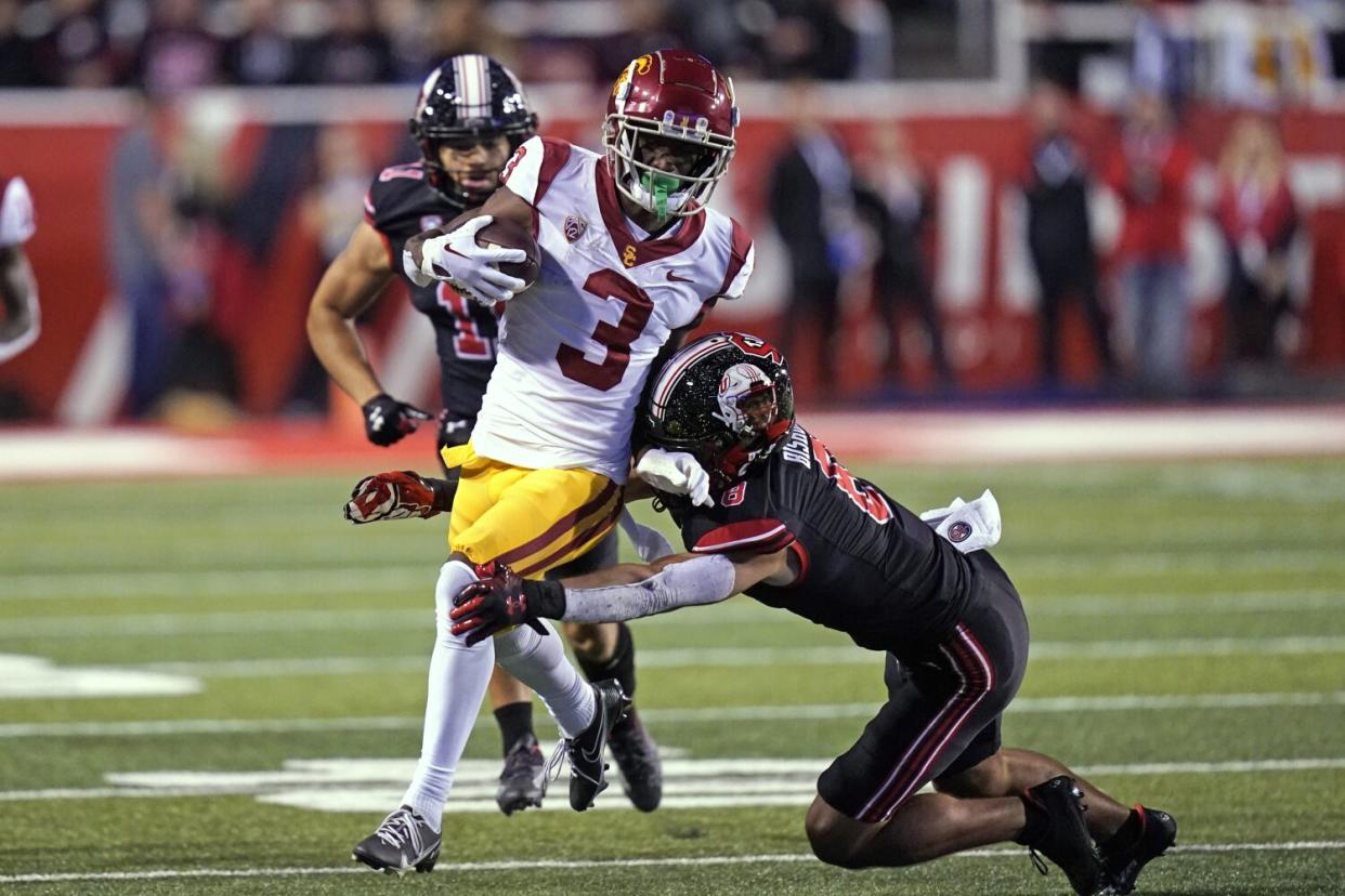 USC's Jordan Addison gets tackled.