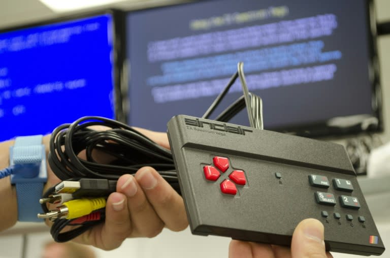 The ZX spectrum's newly created successor, the handheld ZX Vega, replicates the original's signature rainbow stripes on a black rectangular joypad with red arrow buttons