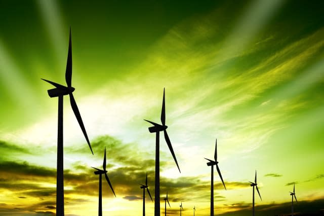 Wind turbines farm at sunset