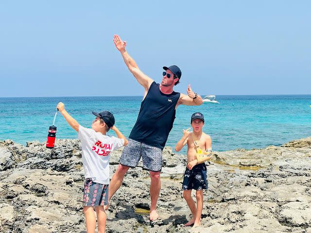 <p>Chris Hemsworth Instagram</p> Chris Hemswoth with his kids in Spain