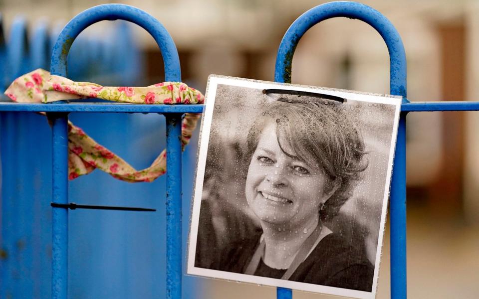 A photograph of Ruth Perry attached to the fence outside John Rankin Schools in Newbury