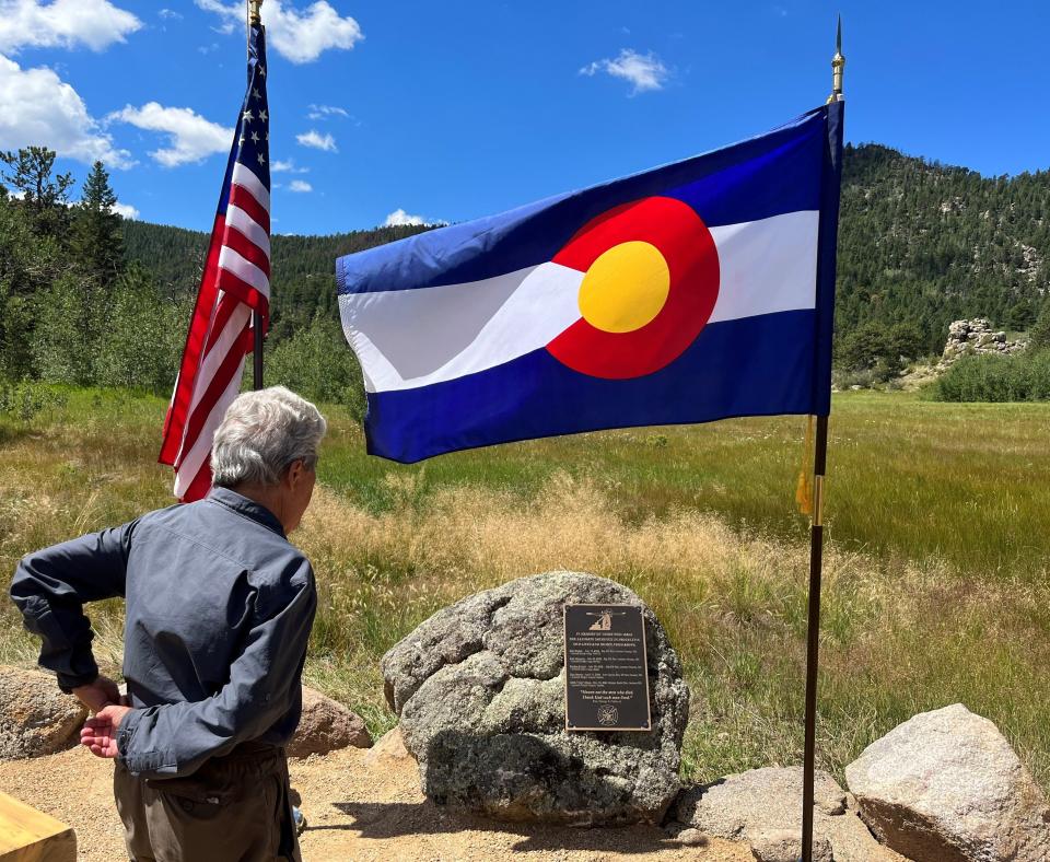 Larimer County Commissioner John Kefalas looks at the Fallen Aviator Firefighter Memorial at a dedication Wednesday, Aug. 17, 2022, at Hermit Park Open Space near Estes Park, Colo.