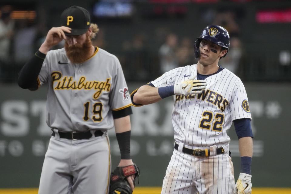 Milwaukee Brewers' Christian Yelich reacts after hitting a three-run scoring double during the fourth inning of a baseball game against the Pittsburgh Pirates Saturday, June 12, 2021, in Milwaukee. (AP Photo/Morry Gash)