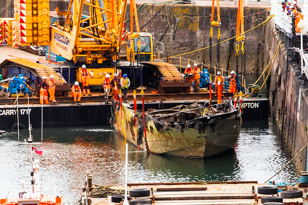 Work has begun to remove superyacht Rendezvous from Torquay harbour. (SWNS)