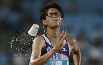 RNPS YEAR END 2014 - BEST OF SPORT ODDLY Taiwan's Chang Wei-Lin competes during the men's 10,000m race walk at the 2014 Nanjing Youth Olympic Games in Nanjing, Jiangsu province, in this August 24, 2014 file photo. REUTERS/Aly Song/Files (CHINA - Tags: SPORT OLYMPICS ATHLETICS TPX IMAGES OF THE DAY)