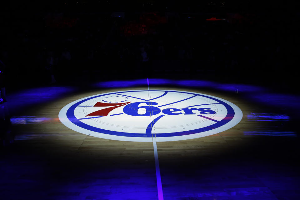 The Philadelphia 76ers' lhalf-court logo is shown before an NBA basketball game against the Cleveland Cavaliers, Friday, Nov. 8, 2013, in Philadelphia. (AP Photo/Matt Slocum)