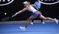 Germany's Angelique Kerber makes a backhand return to Australia's Priscilla Hon during their second round singles match at the Australian Open tennis championship in Melbourne, Australia, Thursday, Jan. 23, 2020. (AP Photo/Andy Brownbill)