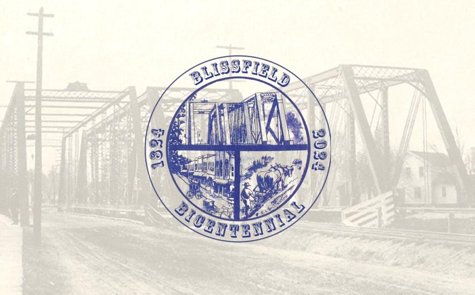 The official logo for Blissfield's bicentennial year, 1824-2024, is pictured. Among the images in the logo are the triples bridges Blissfield is well known for. The three bridges stood next to each other and crossed the River Raisin to accommodate train and vehicular traffic.