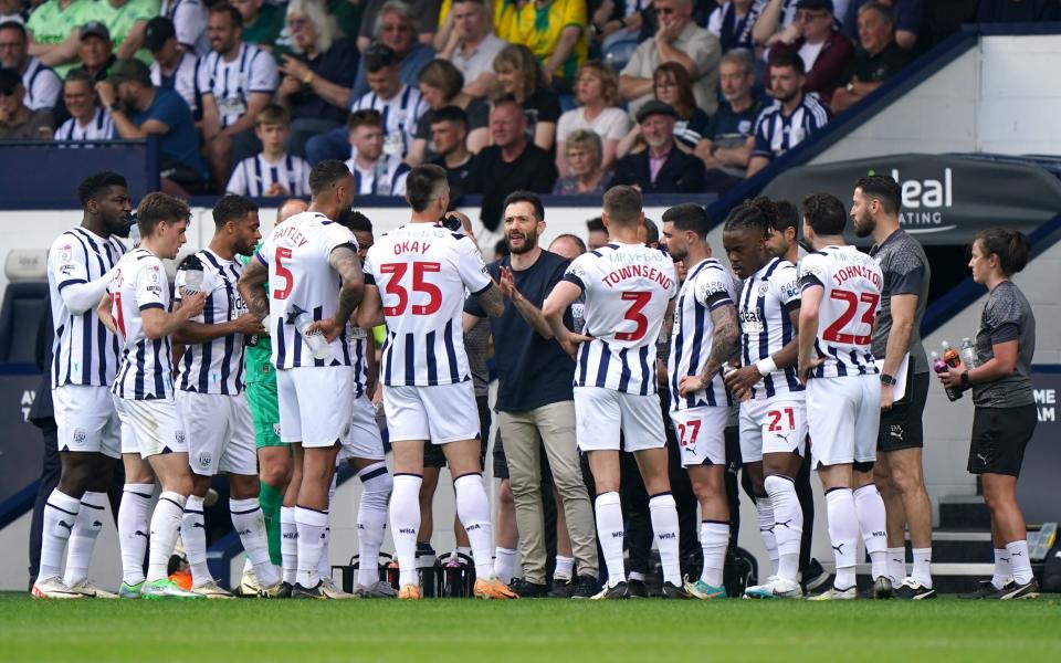 The West Brom take drinks on board during a break in play