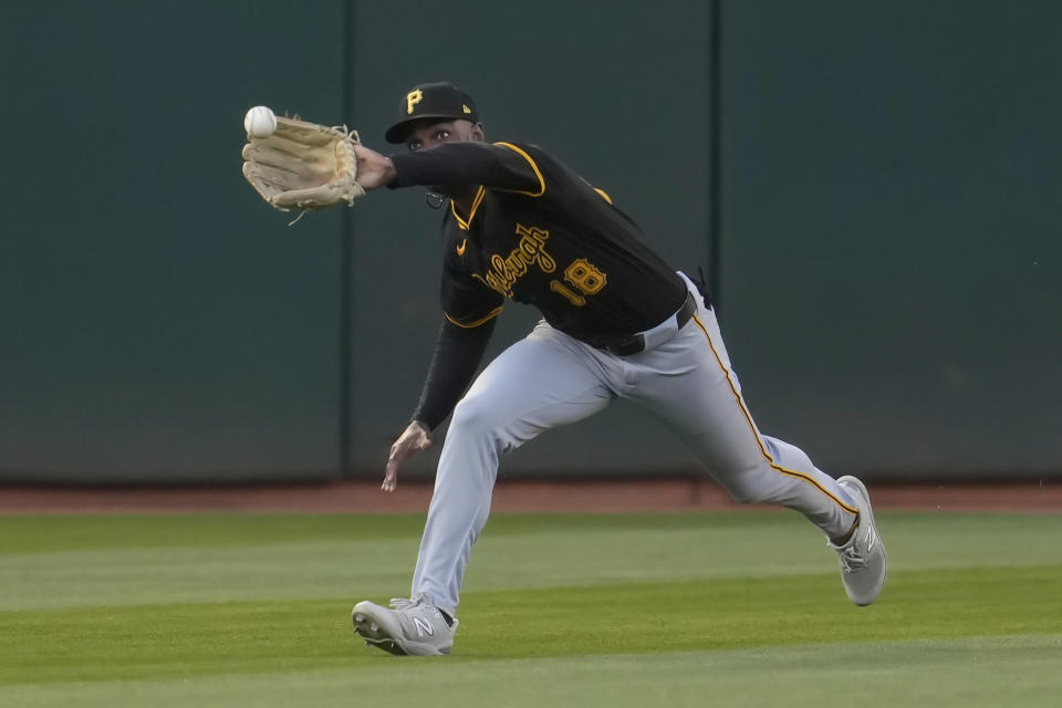 Pittsburgh Pirates outfielder Michael A. Taylor catches a line out hit by Oakland Athletics' JJ Bleday during the first inning of a baseball game in Oakland, Calif., Tuesday, April 30, 2024. (AP Photo/Jeff Chiu)