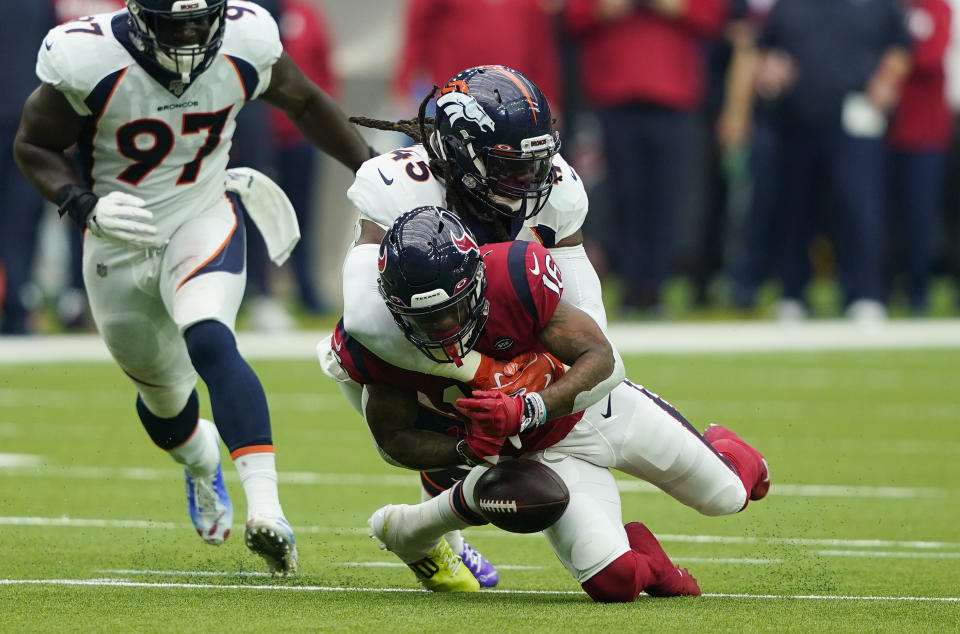 Houston Texans wide receiver Keke Coutee (16) fumble as he is hit by Denver Broncos linebacker A.J. Johnson (45) during the first half of an NFL football game Sunday, Dec. 8, 2019, in Houston. Denver scored on the play. (AP Photo/David J. Phillip)