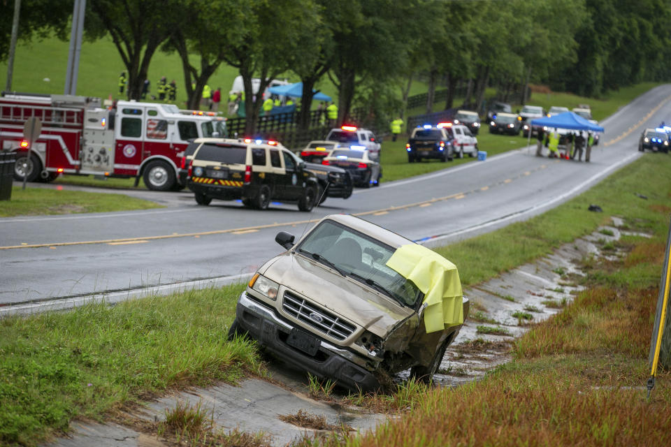 Emergency personnel respond to the scene of a deadly crash on Tuesday, May 14, 2024 near Dunnellon, Fla. The Florida Highway Patrol says a bus carrying farmworkers in central Florida has overturned, killing several people and injuring other passengers. (AP Photo/Alan Youngblood)