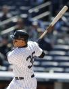 New York Yankees right fielder Carlos Beltran hits a solo home run in the first inning of Game 1 of an interleague baseball doubleheader against the Chicago Cubs at Yankee Stadium in New York, Wednesday, April 16, 2014. (AP Photo/Kathy Willens)