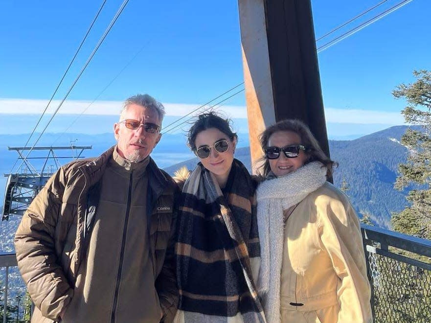 Sandrine Jacquot with her parents at a ski resort.