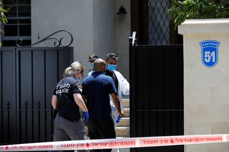 Israeli police and forensic experts enter the house of China's ambassador to Israel, Du Wei, in Herzliya, near Tel Aviv, Israel