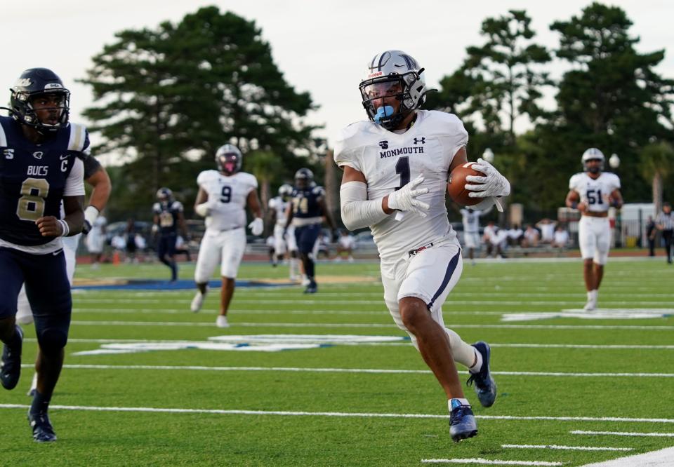 Monmouth's Eddie Morales (1) returns an interception 77 yards during the Hawks' 41-14 victory over Charleston Southern in Charleston, South Carolina on Sept. 18, 2021.