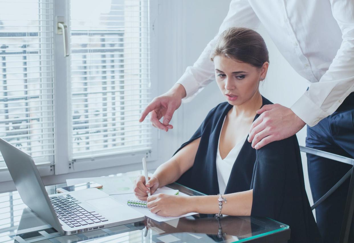 <span class="caption">Unwanted touching in the office is an all-too-common experience for women.</span> <span class="attribution"><a class="link " href="https://www.gettyimages.com/detail/photo/sexual-harassment-at-work-royalty-free-image/1216847792" rel="nofollow noopener" target="_blank" data-ylk="slk:anyaberkutiStock via Getty Images;elm:context_link;itc:0;sec:content-canvas">anyaberkutiStock via Getty Images</a></span>