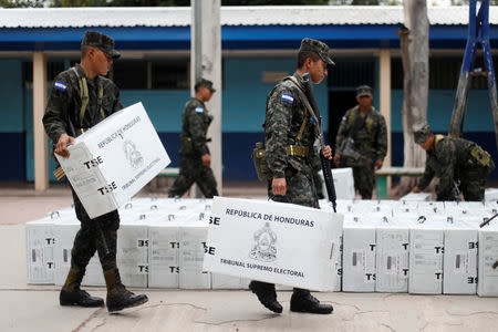 Soldiers move election materials for distribution at voting stations ahead of the November 26 presidential election in Tegucigalpa, Honduras, November 25, 2017. REUTERS/Edgard Garrido