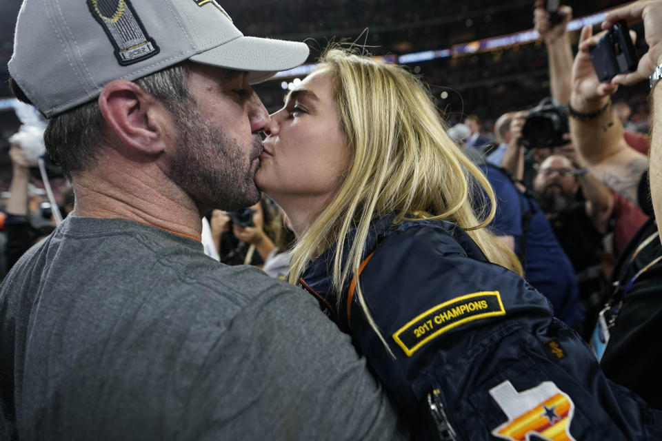 Houston Astros starting pitcher Justin Verlander kisses his wife Kate Upton as the team celebrates their 4-1 World Series win against the Philadelphia Phillies in Game 6 on Saturday, Nov. 5, 2022, in Houston. (AP Photo/David J. Phillip)