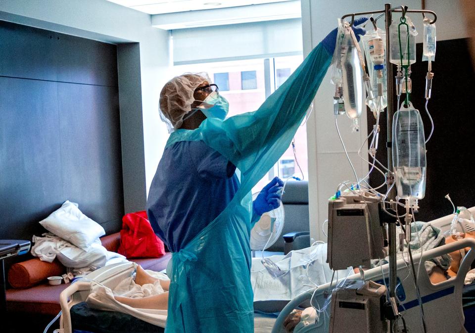 A nurse cares for a patient in 2021 in the COVID ICU at SSM Health St. Anthony Hospital in Oklahoma City.