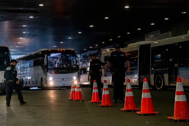 Asylum seekers arrive by bus at the Port Authority bus terminal in New York on Sept. 9, 2022. 