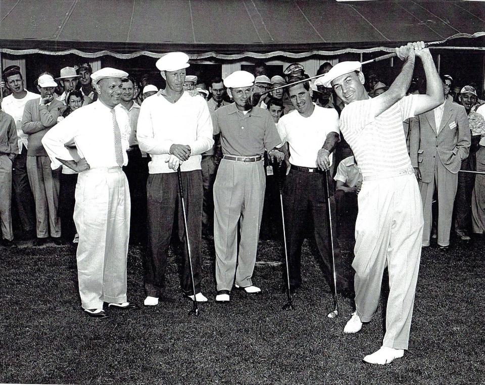 Ben Hogan swings while, from left, Nick Legnini (IBM Country Club pro), Aldor Jones, Al Morley and Toby Lyons look on.