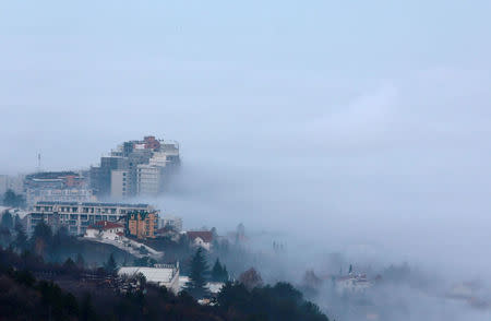 Buildings are seen as fog blankets the city of Skopje, Macedonia December 15, 2017. REUTERS/Ognen Teofilovski