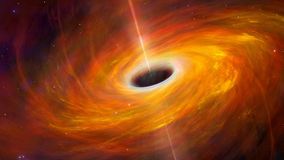 a black hole at the center of a swirling orange cloud