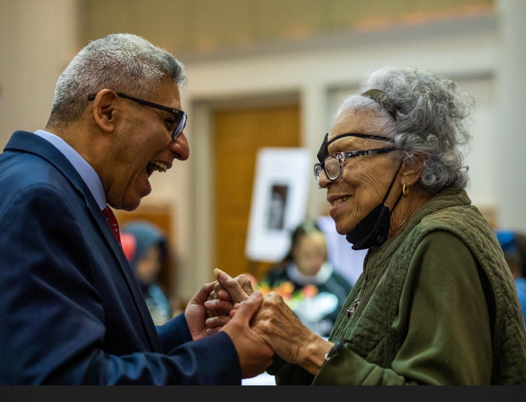 Juan Salgado, at left, chancellor of the City Colleges of Chicago, shares a laugh with Sandra McWorter Marsh at a February 2023 luncheon held at Kennedy-King College to honor Marsh's donation of more than 1,700 cookbooks to the school's culinary program.
