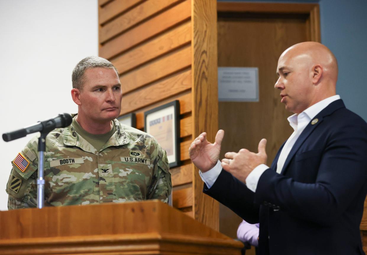 U.S. Rep. Brian Mast discusses the recent Lake O discharges with Col. James Booth, Army Corps of Engineers, during a Rivers Coalition meeting, Thursday, Feb. 22, 2024, at 121 S.W. Flagler Ave. in Stuart.