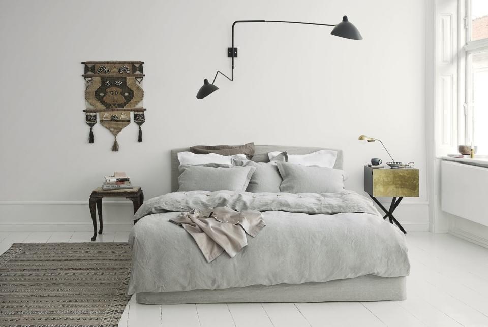 <p>Soft grey tones set a relaxing atmosphere for sleep. In this room, the bed is dressed in linen by Geismars (from £49 for a pillowcase; geismars.dk) that will only get softer over the years. Paired with white walls and floors, plus a Parisian design classic in the form of a Serge Mouille wall light, it’s an effortlessly chic approach.</p>