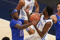 Kentucky's Terrence Clarke (5) is defended by Kansas' Marcus Garrett (0) during the first half of an NCAA college basketball game Tuesday, Dec. 1, 2020, in Indianapolis. (AP Photo/Darron Cummings)