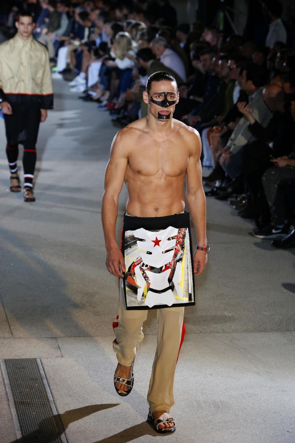 A model presents a creation as part of the Givenchy men's fashion Spring-Summer 2014 collection, presented Friday, June 28, 2013 in Paris. (AP Photo/Francois Mori)