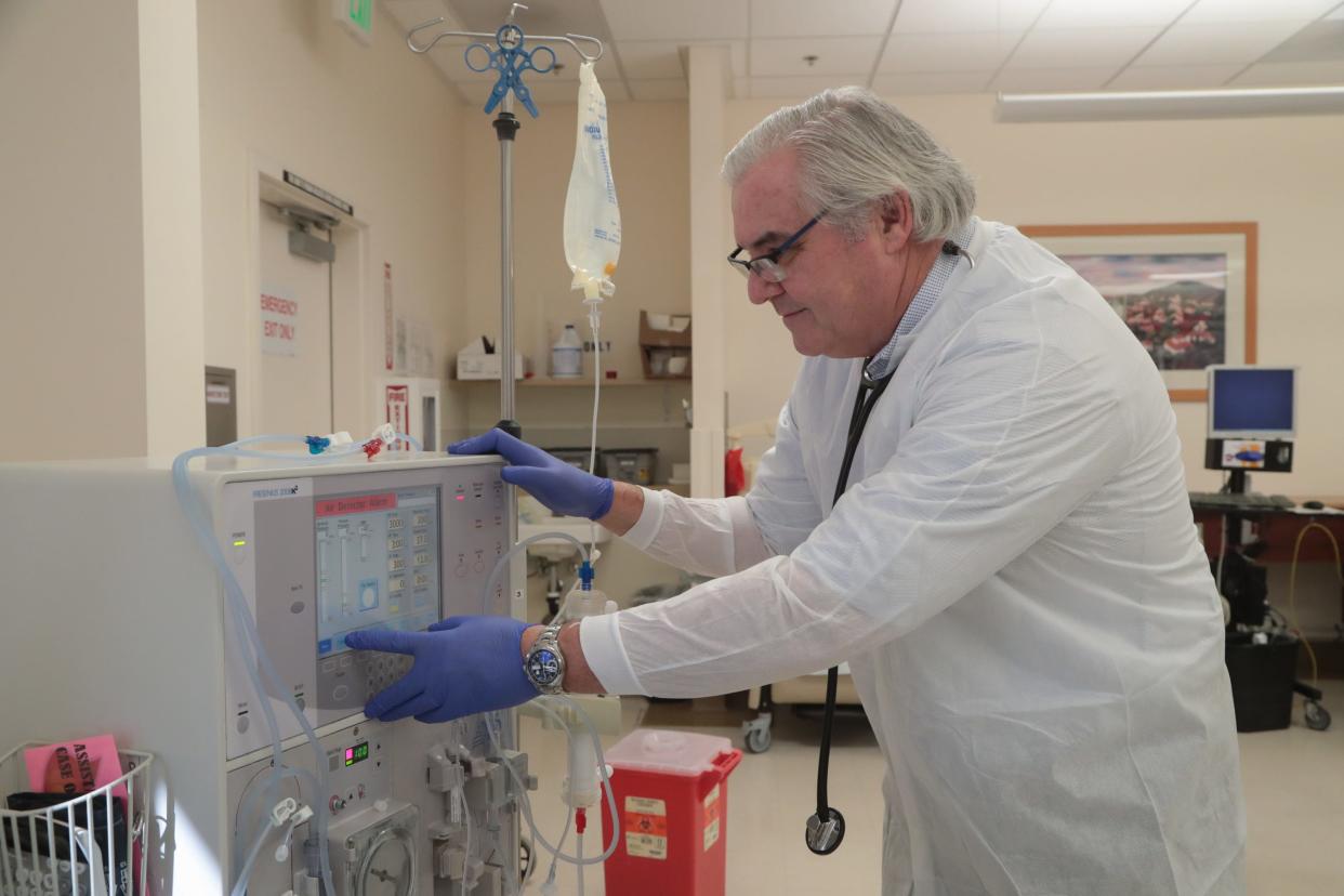 Dr. John Robertson operates a dialysis machine at a DaVita Dialysis center in Cathedral City, Calif., October 11, 2018.